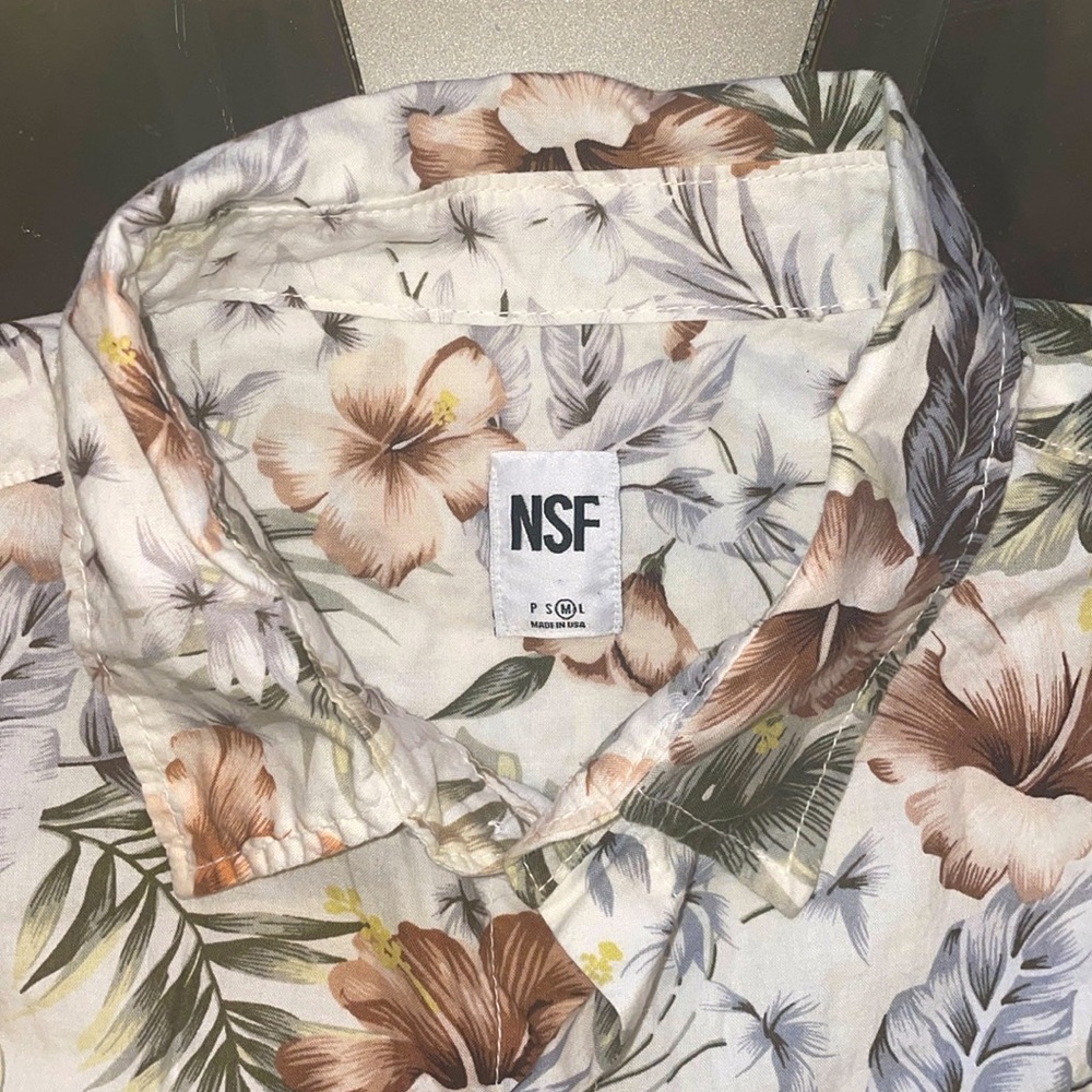 NSF Short sleeve button up shirt.
